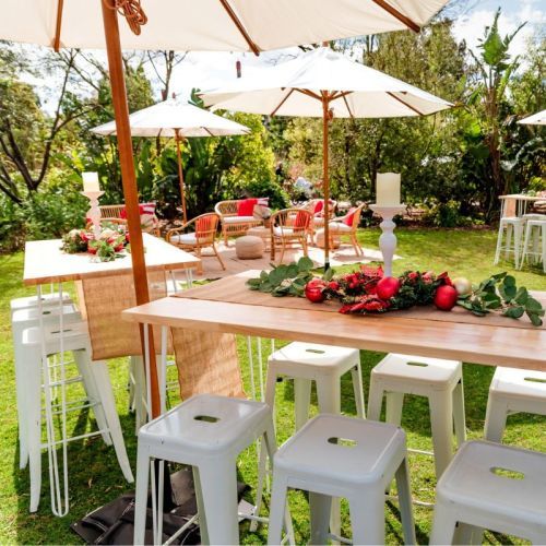 clos up two timber bar benches with white bar stools