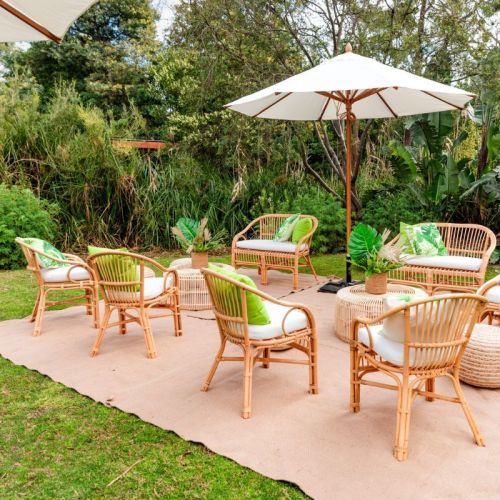 rattan outdoor setting green pillows