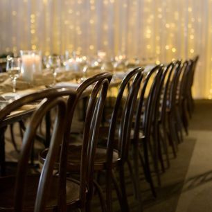 close up walnut bentwood chairs