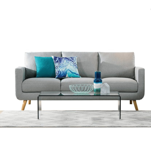 grey sofa staged with blue pillows