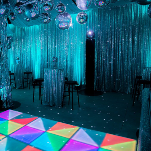 silver disco with sequin drape and aqua blue lighting